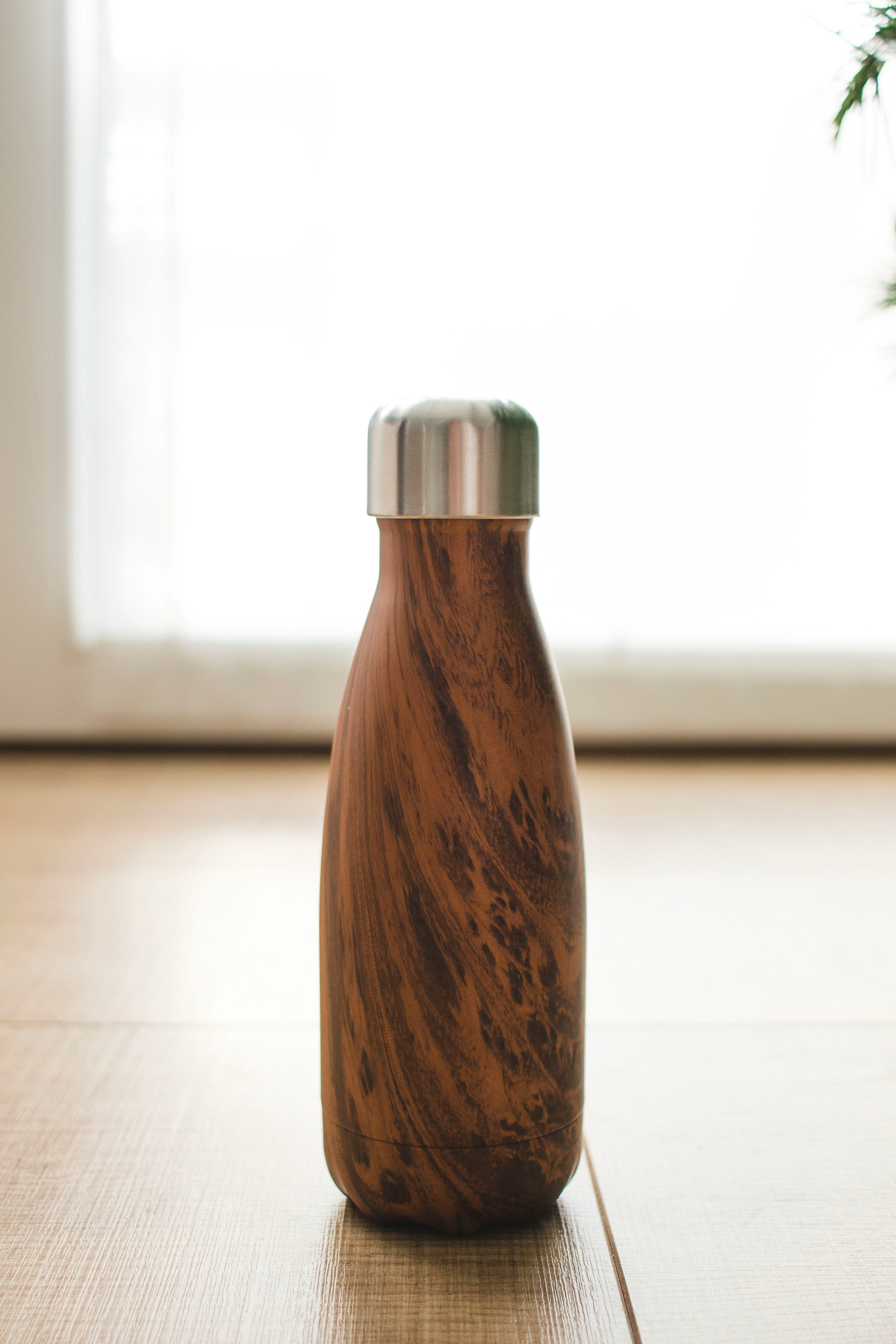 Ergonomic Tapered Water Bottle with Natural Wood-Grain Finish